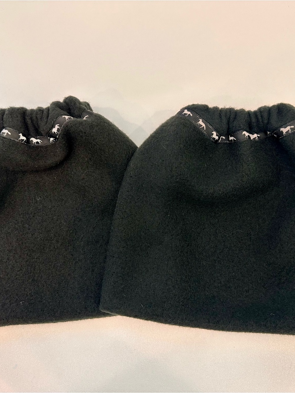 Black Fleece Stirrup Covers with Horse Print Trim